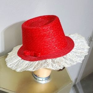 Red straw hat with white lace brim